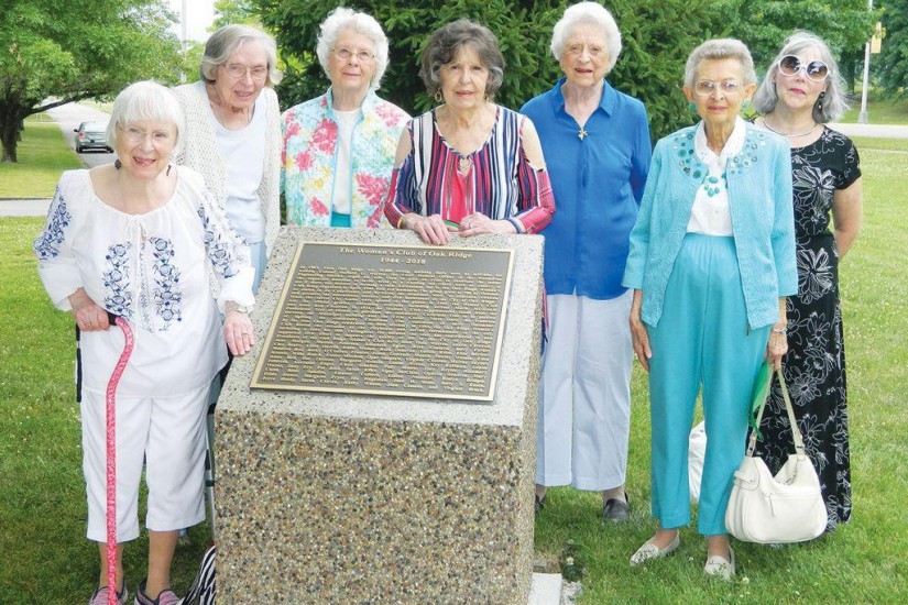 Some of Oak Ridge Woman's Club Past Presidents stand before the new monument at the Secret City Commenmorative Walk
